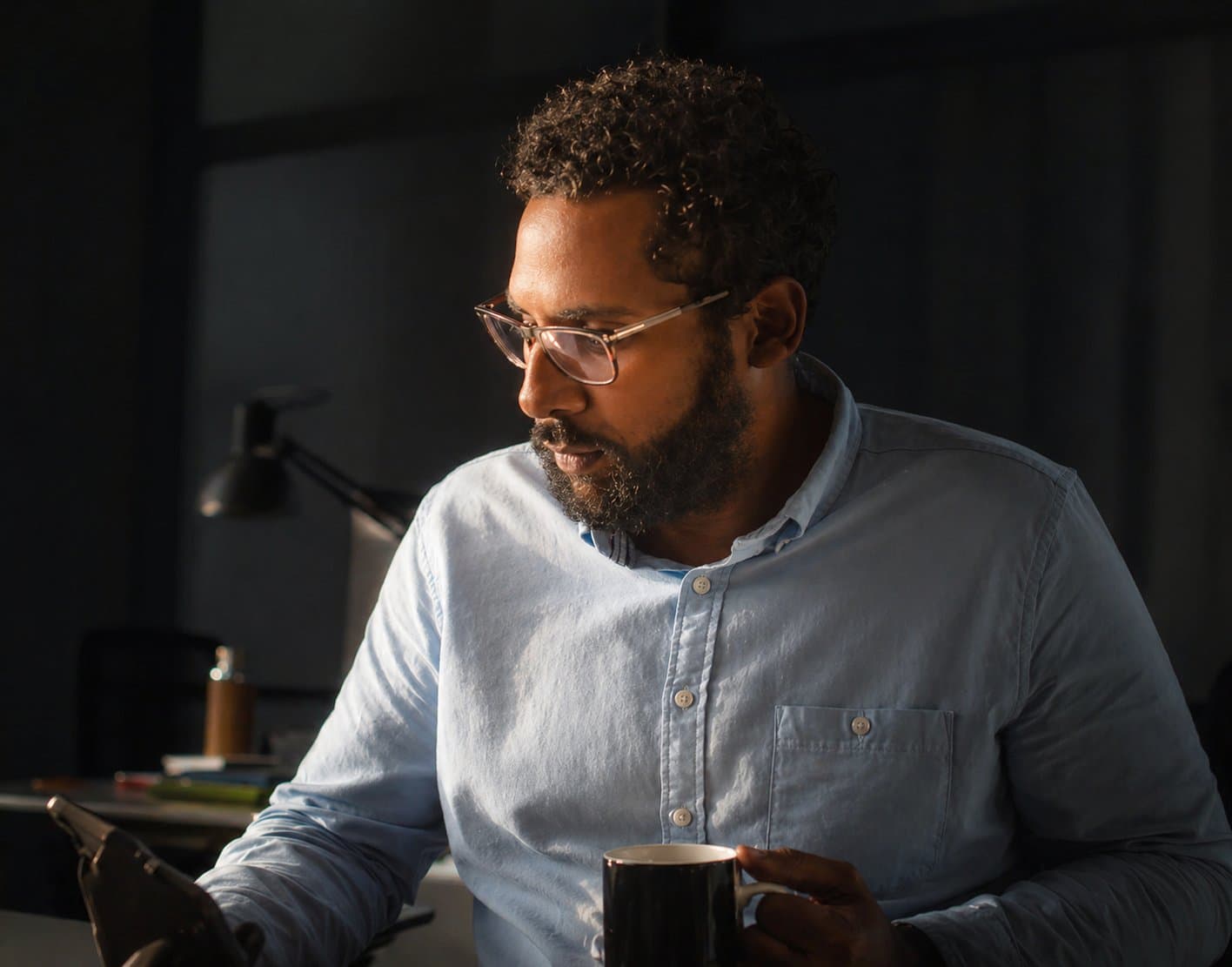 Finance professional reviewing the close on a tablet
